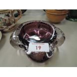 A vintage purple glass trinket dish with control bubble