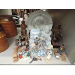 A selection of vintage figures and figurines including unusual pressed glass dog head jar