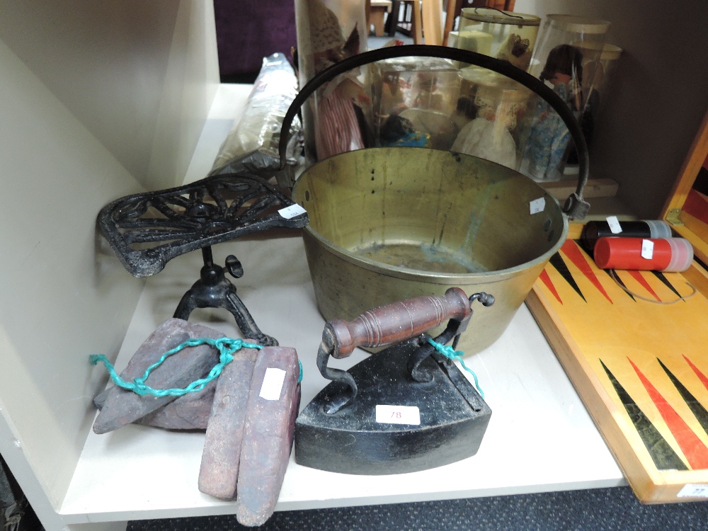 A selection of vintage fire side items including stove iron, and brass jam pan