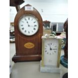 Two vintage clocks one wooden in a bishops hat design and carriage clock