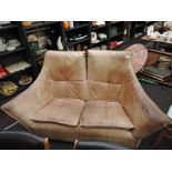 A vintage tan leather two seater settee, batwing style