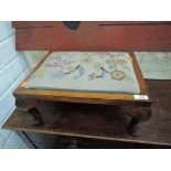 A traditional oak frame tapestry top footstool