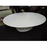 A vintage Arkana coffee table, on painted tulip style base, in white