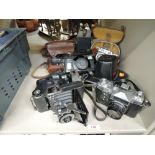 A selection of vintage cameras and photography equipment including King Penguin