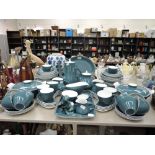 A large part dinner tea coffee service by Pool pottery in a teal two tone design