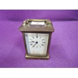 A vintage carriage clock bevel edged glass brass body