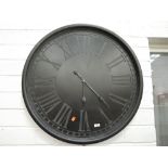 A modern oversized wall clock