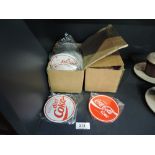 A selection of vintage Coca Cola advertising coasters classic and diet