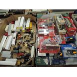 Two boxes of HO scale and similar diecast and plastic American vehicles including Trident, Herpa,