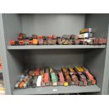 Two shelves of HO scale kit built American rolling stock, approx 120 items