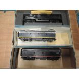 A Athearn HO scale American brass locomotive and tender 8042 and a Athearn Santa Fe tender all