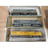 Two Athearn HO scale American brass Southern Pacific locomotives in grey livery and a Athearn HO