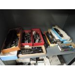 A shelf of part made HO scale American brass and plastic locomotive and rolling stock kits along