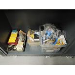 A shelf of HO scale track modelling accessories including Peco, Kadee etc, switches, electrics,