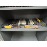 A shelvf of HO scale kit built American carriages, approx 22 items and two engines