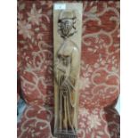 A vintage carved relief panel with possible Roman Catholic religious imagery