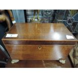 A vintage wooden trinket box footed with lions had handles and divided interior