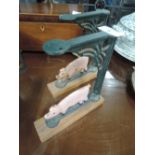 A pair of vintage cast wall brackets with pig design