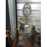 A vintage Art Nouveau design lamp with figural lady and moving time piece