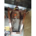 A vintage converted gas style lamp with copper body and cast bracket