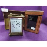 A vintage carriage clock made in France with carry case and key