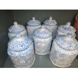 A selection of vintage ceramic kitchen jars by Arthur Wood in the Saxony design