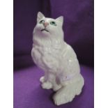 A vintage figure of a white cat or kitten by Beswick