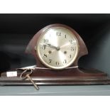 A vintage mantle clock with chime in a Napoleonic design