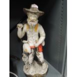 A ceramic figure of a gentleman of the road