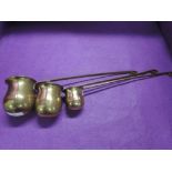 A set of vintage graduated spirit ladle Brandy Rum and Whisky