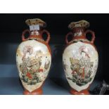 A pair of vintage oriental mirrored vase with good enamel detailing and marks to base