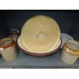 A selection of vintage earthen ware salt glazed kitchen ceramics including butter bowls