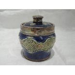 A Royal Doulton lidded pot in shades of blue and beige having silver knob and collar, London 1919, M