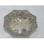 A silver trinket dish of octagonal form having repousse decoration, Sheffield 1898, Fenton