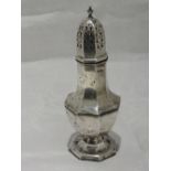 A large silver sugar caster of octagonal baluster form with push on pierced lid, Sheffield 1911,