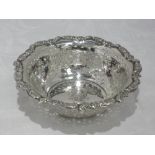 An Edwardian silver bowl having pierced decoration, moulded shaped rim and Xmas 1902 printed to