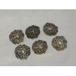 A set of six Victorian silver buttons having moulded scroll and floral decoration, Birmingham