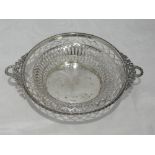 A silver basket having moulded ribbon handles and rim over pierced bowl, Birmingham 1911, Henry