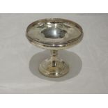 A small silver tazza of plain circular form having moulded rim and pedestal base, Birmingham 1971, A