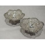 A pair of Victorian silver trinket dishes having moulded rims, pierced and bow decoration to bowl