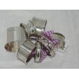 Six HM silver napkin rings of various forms