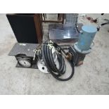 An electric motor, spraymaster and vintage luggage/personal scale