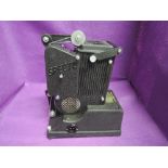 A vintage Specto film projector in leather case