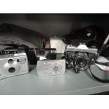 A election of cameras and equipment including Fujica ST301, Polaroid DC3035, Pentax PC35, a Vanguard