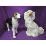 Two vintage dog figures a hound and Staffordshire flatback