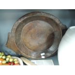 An antique heavy set and carved treen wood fruit or bread bowl