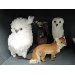 A selection of vintage faux fur animals and an owl candle