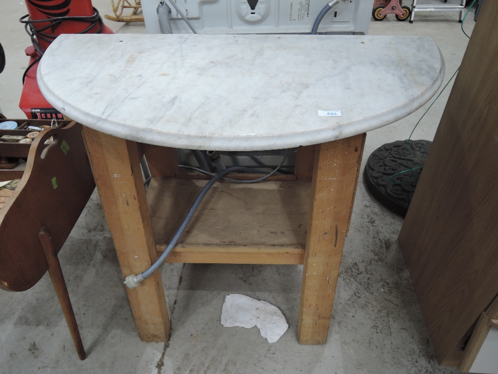 A work bench and marble wash stand top