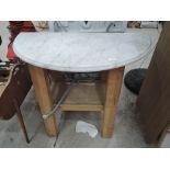 A work bench and marble wash stand top