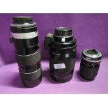 Three lenses a Nikon Nikkor 35-105mm, a Reflex Nikkor C and a Tamron 70-220mm